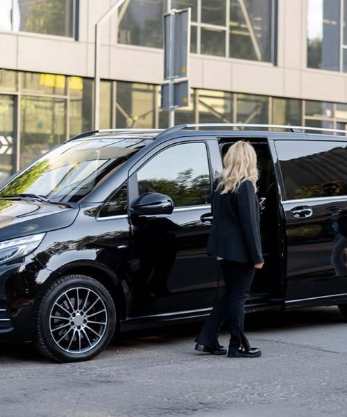 2 People seating in a maxi taxi